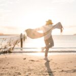 woman dancing near the shore